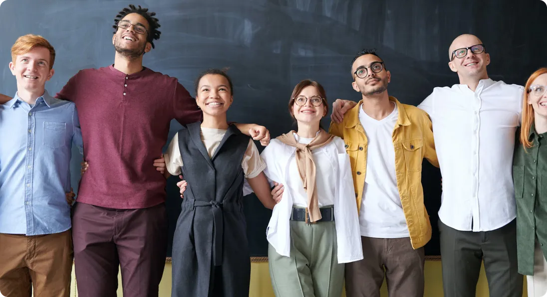 The Markivo team standing together in front of a blackboard